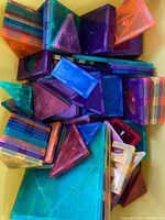 pile of multicolour translucent magnetic tiles