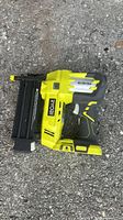 Left side view of Ryobi AirStrike brad nailer showing body, magazine, branding
