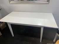 Table fully extended with leaves installed