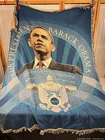 Full view of woven Barack Obama inauguration blanket showing design and fringe