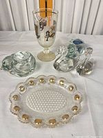 Group shot showing goblet, plate, swan and cat dish
