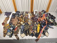 Full group of approx. 40 neckties spread on table