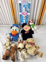 Overview of all plush toys, puppets and boxed violin