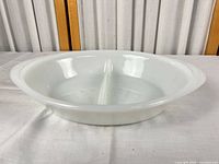 Top view of white Glasbake divided serving dish showing two compartments