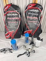 Full lot: two Head racquets with cases, ball canisters, goggles, water bottle