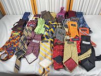 Full layout of assorted neckties on table