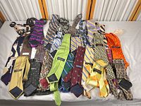 Overview of entire assortment of ties laid out on table