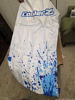 White panel with CoolerZ logo and blue splatter design