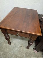 Full view of Ethan Allen side table showing top, legs, drawer closed