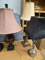 Three table lamps showing different bases and shades