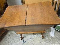 Top view of the side table showing split hinged lid and wood grain