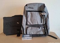 Front view showing both bags, backpack tags visible