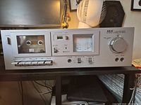 Front view of Akai CS-M01A showing cassette well, VU meters and controls