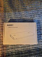 Closed AUKEY box showing line drawing and capacity label