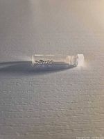 Vial lying on its side containing clear findings