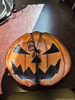 top view of one orange glass jack-o-lantern plate