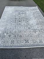 Full view of entire rug laid flat outdoors