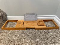 Bath caddy fully extended showing supports and slots