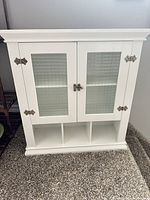 Front view of white bathroom wall cabinet