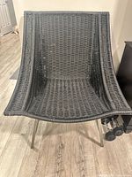 Front view of black wicker lounge chair
