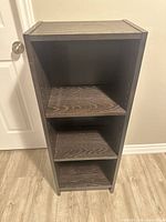 Front view of dark wood 3-tier bookshelf showing shelves and dimensions perspective