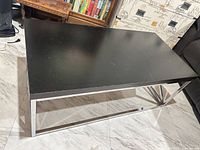 Full view of coffee table showing top surface and metal frame