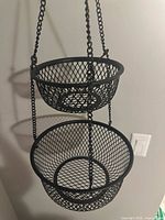 full view of double hanging basket against wall