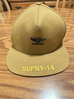 Front view showing eagle patch and SUPNY-14 brim embroidery
