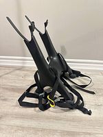 Full view of Saris Solo rack standing upright showing arms, feet and straps