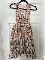 Front view of full bib apron on hanger