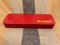 closed red metal Outers tin