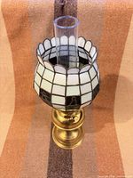 Full assembled lamp showing shade, chimney and brass base