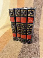 Front spines of four matching encyclopedia volumes