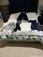 All garments laid out on bed