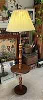 Full view of floor lamp with table and shade