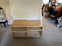 Front view of shelving unit showing two compartments and feet