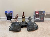 All items overview: boxed hat, gloves, turkey figurine, whiskey bottle, hawk figurine, tool belt
