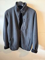 front view of charcoal grey jacket on hanger