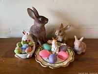 Full view of bunny figurines, dish, plate and eggs