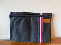 Front view showing zipper, stripe and Consul patch