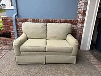 Front view of Ethan Allen loveseat showing overall design and condition