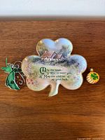 Front view of shamrock plate, angel ornament, gold shamrock ornament