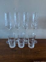 Group of three Lenox flutes and three etched cordial glasses