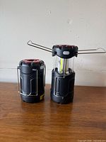 Two lanterns collapsed and expanded to show design