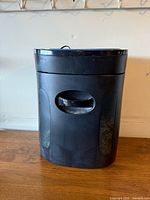 Front view of Royal 1216X shredder showing bin and carry handle