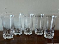 Front view of five Baccarat Harmonie highball glasses lined up
