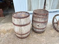 front view of both oak barrels showing staves, hoops, and bung holes