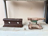 Anvil and railway tie segment side by side