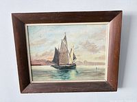 Front view of framed sailboat painting signed C. McEnter