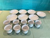 Set of bowls and teacups arranged on table